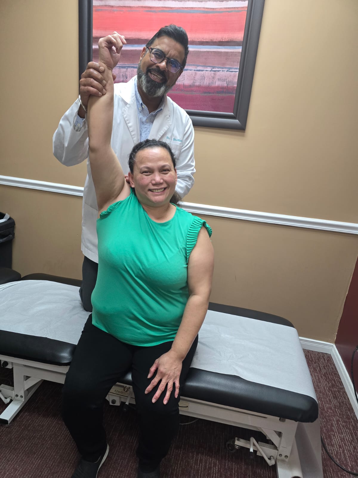 chiropractor Brampton Dr. Dhillon performing a hands‑on spinal adjustment at DRS Physio & Wellness